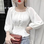 Virginia – Blusa off shoulder elegante con volantes
