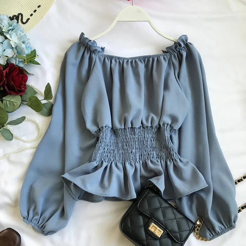 Virginia – Blusa off shoulder elegante con volantes