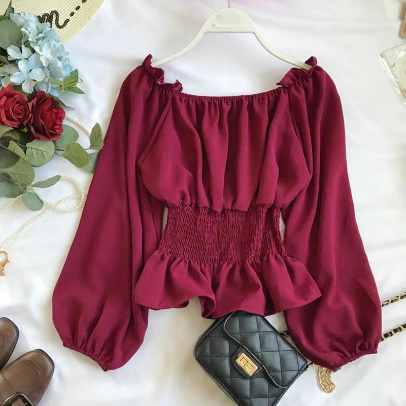 Virginia – Blusa off shoulder elegante con volantes