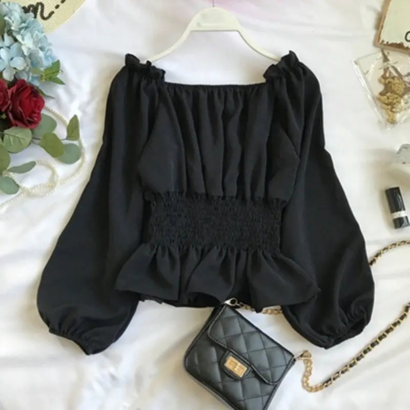 Virginia – Blusa off shoulder elegante con volantes